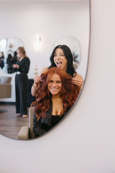 Happy client and stylist after hair appointment