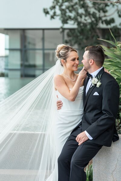 Bride and groom smile at each other after their destination wedding ceremony