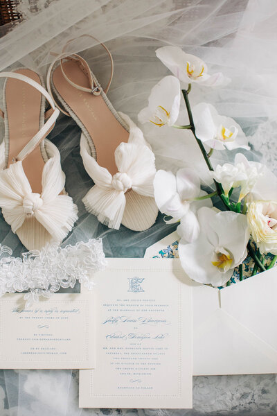 wedding flatlay photography, with white shoes and dogwood flowers