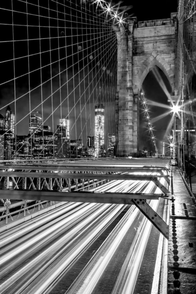 Black and white photo of a city bridge symbolizing connection, growth, and the freedom that comes from building an intentional business.