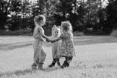 Three girls holding hands in a circle | Family Photos