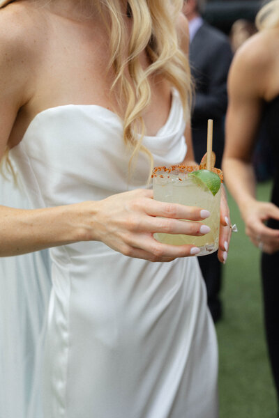 Bridal Fashion at a wedding cocktail hour in Santa Barbara California,  colorful details by Lindsey Whatley Photo, wedding photographer based in Southeast and California