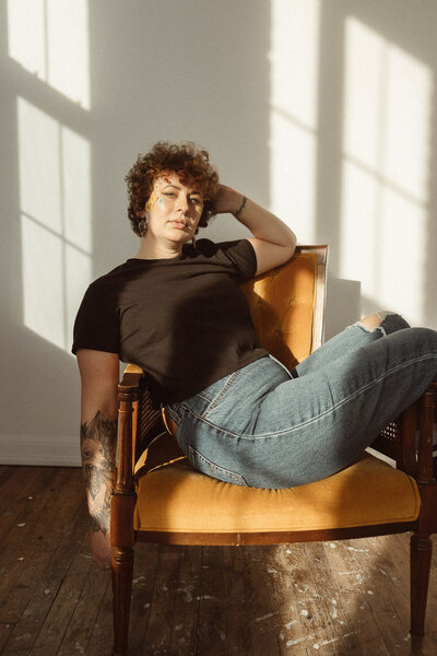 portrait of twin cities photographer sitting in chair