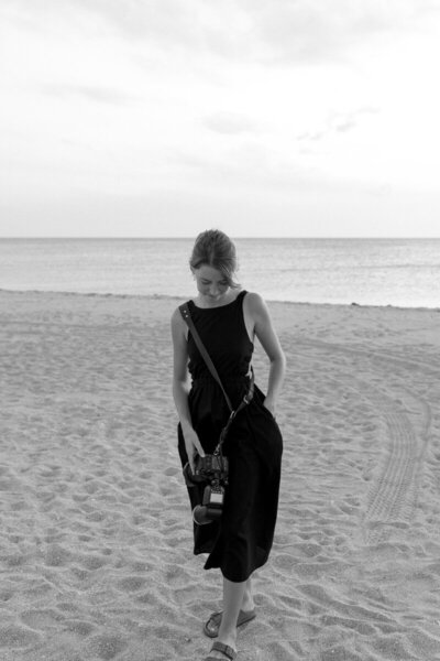 Shelby Ann Photos posing on a beach as amelia island photographers