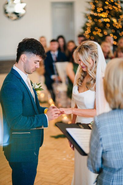 Couple exchanging rings at Mytton Fold Hotel Taken by Anthony Horseman wedding videographer and photographer
