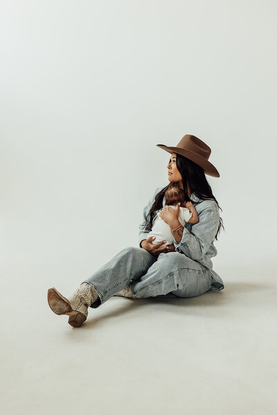Motherhood session in a studio with mom and her baby