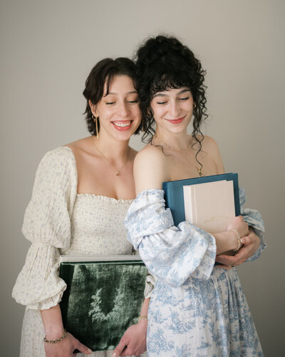 huntsville photographers holding photo albums
