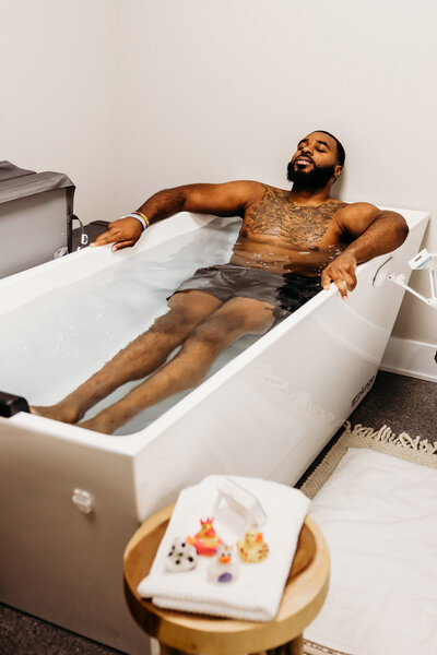 Man sitting in the cold plunge at vIVid