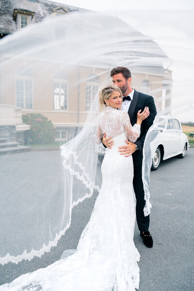 Newport Rhode Island Wedding Photographers | Rhode Island Caprio Captured Photography | Bride And Groom Kissing in front of Newport Country Club
