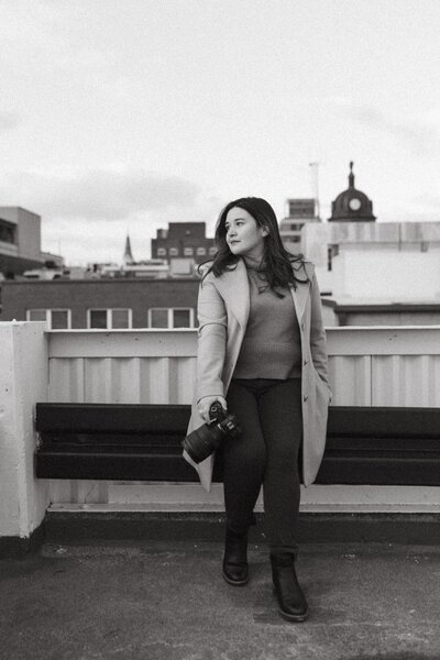 jennifer kahl poses with camera for brand photos