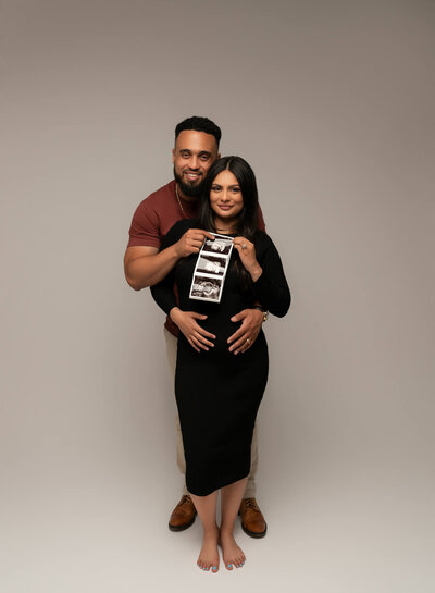 A couple announcing their pregnancy using an ultrasound