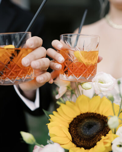 Wedding reception with orange mimosas and sunflower bouquets | Megan Smith Photography