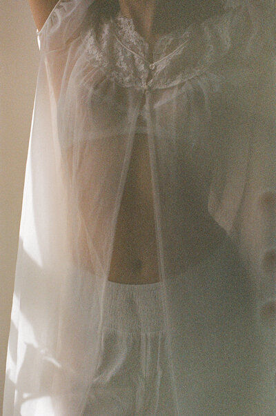 Ethereal Boudoir photos of a woman in vintage slip