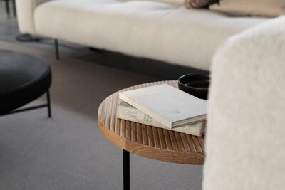 Calm, inviting therapy-style office space with books and a neutral-toned sofa — a setting often used by a non-diet dietitian for virtual or in-person sessions.
