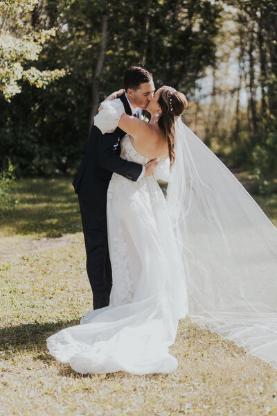 A couple celebrates their first kiss after their ceremony in Saskatchewan