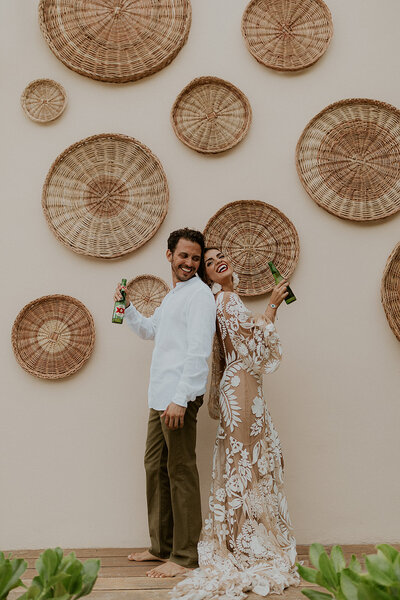 bride and groom standing back to back