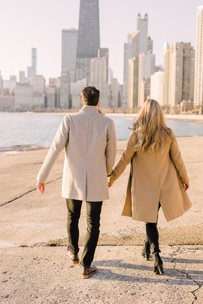 Couple take a stroll along the magnificent lakefront in Chicago's Lincoln Park neighborhood.