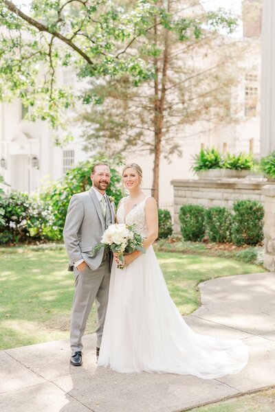 Bride and groom pose for classic wedding portrait