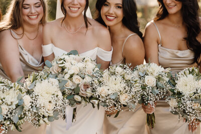 bridesmaids holding bouquets on wedding day