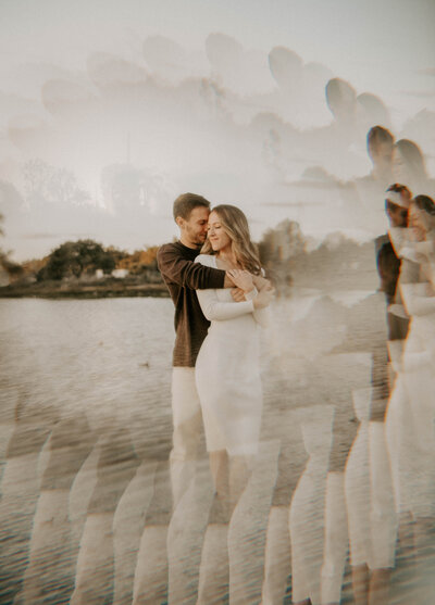 couple embracing by lake