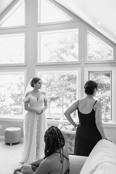 brantford bride waits patiently with bridesmaids black and white