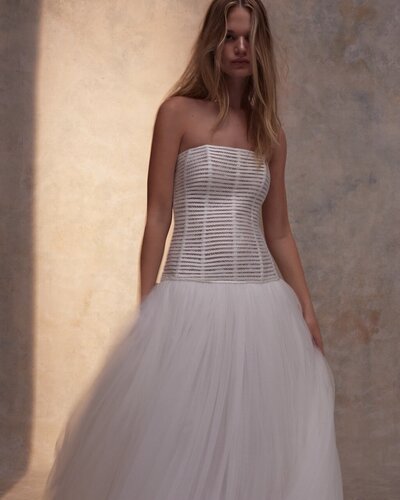 black and white image bride wearing feathered wedding dress