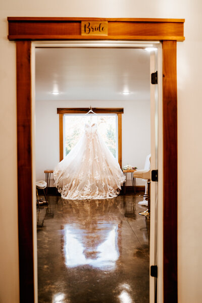 Wedding dress hanging up at the Pineneedle venue