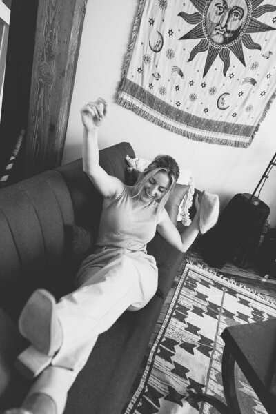 Steph Fuerst falling back on couch in studio