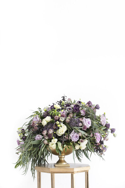 Fresh flower centerpiece with shades of purple and green