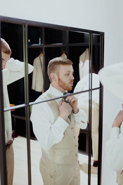 groom Suite getting ready at The Rosewood Venue in Mount Vernon Texas groomsmen getting ready dallas wedding photographer outdoor wedding