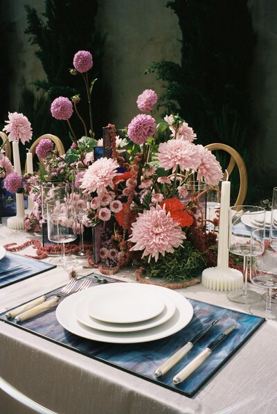 Pink flowers sit on a table