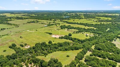 View across the pasture with rolling terrain and clear skies