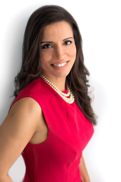 Latina Business woman in red dress