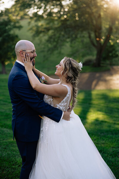 bride and groom embrace after wedding in lancaster pa