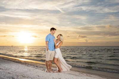 Couple on Bean Point Beach at sunset on Anna Maria Island
