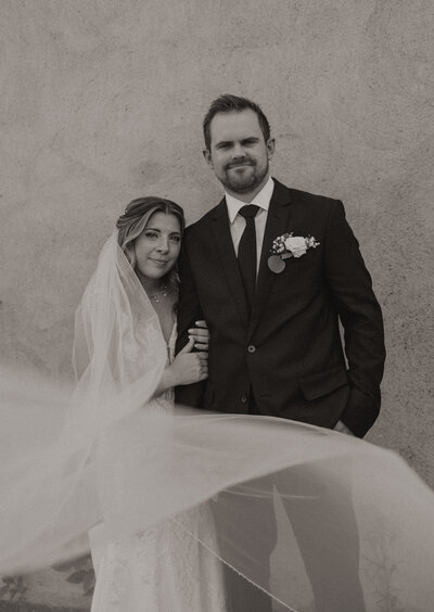 Married couple on their wedding day taking photos in downtown Delano