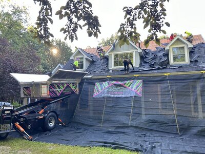 view of Catch-All protecting the property and Equipter raised to the roof for debris to be collected in