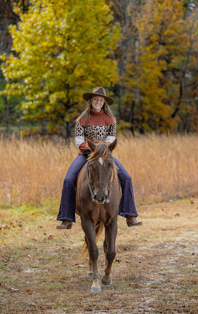 Senior riding a Chestnut Horse