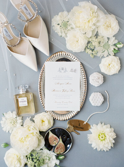 bridal details arranged in a fine art styled flat lay