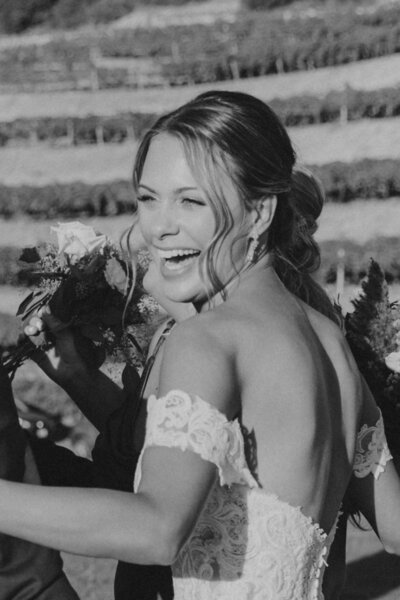Black and white photo of bride smiling on her wedding day in Sacramento, CA.