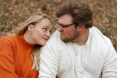 Engagement session with woman leaning her head on fiance's shoulder