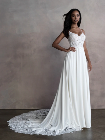 Gorgeous appliques pair perfectly with this sleeveless gown's fitted crepe skirt.