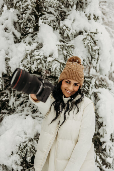 glacier national park elopement photographer posing in front of the camera for her headshots