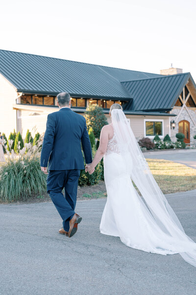 Bride and groom looking at each other while sitting at Pleasant Hill Home
