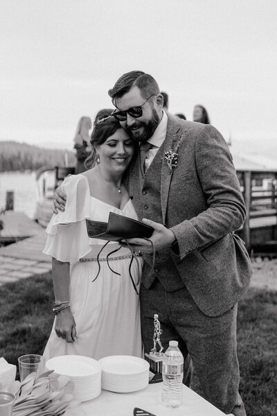 A joyful, candid moment between a bride and groom on their wedding day, capturing authentic love and emotion in Spokane, Washington.