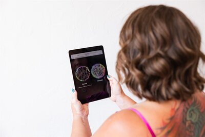 Canon City therapist showing the benefits of psychedelic-assisted therapy on her iPad