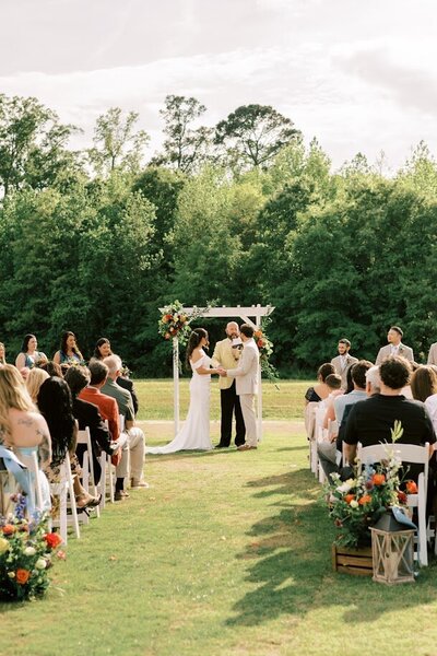 Lawn with white bar, tables and chairs
