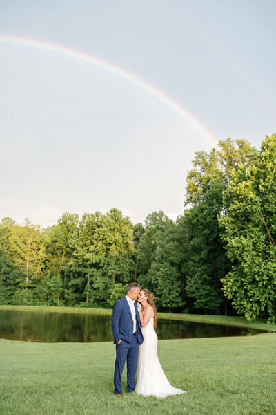 Bride holding her bouquet with her groom in Wilmington, NC