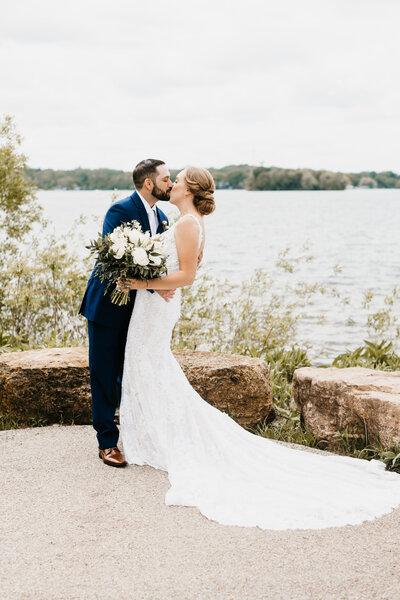 bride-groom-kissing-portrait-lakeside