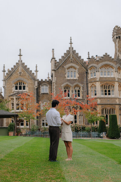 A beautiful proposal in Oakley Court, london. A gothic style stone building. 